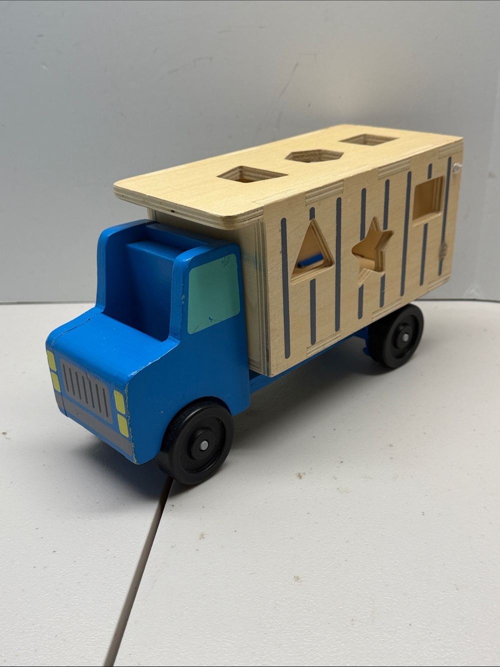 Melissa & Doug Shape-Sorting Wooden Dump Truck Toy- Truck only.